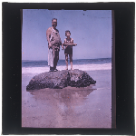 Cover image for Photograph - Glass slide - Standing on rock with fish  (colour) [? Taroona beach]