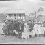 Cover image for Photograph - Negative - Family photo [Wedding? Bride and Groom seated, group standing behind]