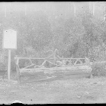 Cover image for Photograph - Glass negative - Mount Wellington [Hotel sign beside seat crafted from tree log]