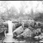 Cover image for Photograph - Glass negative - Farm [Group beside waterfall{?} ]