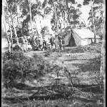 Cover image for Photograph - Glass negative - Farm [Group in bush setting beside tents]