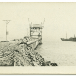 Cover image for Photograph - Maria Island Cement Works - Coal boat leaving wharf