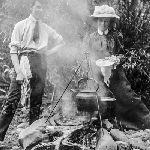 Cover image for Photograph - Man and woman at an outdoor campfire