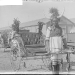 Cover image for Photograph - [wagons and people in costumes] [men with tribal costume, horns on headgear]