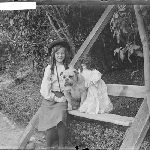 Cover image for Photograph - Girl, bull dog, and doll seated outside