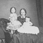 Cover image for Photograph - Unidentified [woman and two infants, studio portrait]