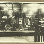 Cover image for Photograph - Interior of store - Charles Davis - window display of radio equipment