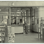 Cover image for Photograph - Interior of store - Charles Davis - accounts section
