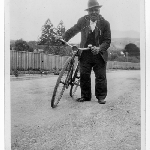 Cover image for Photograph - John Hansborough with bicycle - worked for Miss Cleburne, Mt Direction, Risdon