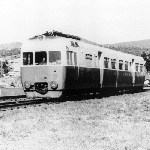 Cover image for Photograph - Side frontal view of south bound articulated railcar just having crossed Risdon Road - December 1974
