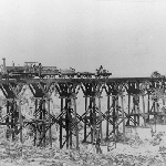 Cover image for Photograph - Train on timber railway bridge - Main Line Railway  at Bridgewater