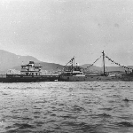 Cover image for Photograph - Side view of the new Bruny Island ferry (Ewen Alison) towed by a New Zealand freighter (Sumatra)