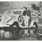 Cover image for Photograph - Campania area 'crossing a ford in the river on the running board of the grocer's car'