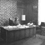 Cover image for Photograph - Tasmanian College of Advanced Education - Principal of the College in his Office