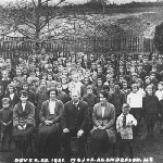 Cover image for Photograph - Dover State School pupils and teachers assembled in group in schoolyard in winter time