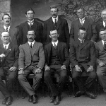 Cover image for Photograph - Men-unidentified group-wearing suits and posing in group photo.