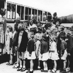 Cover image for Photograph - Dover - School children boarding the school bus
