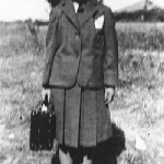 Cover image for Photograph - Dover - School girl in uniform with school case (unidentified)
