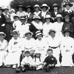 Cover image for Photograph - Women-unidentified group posing for group photograph-all wearing hats-some children in view-possibly lawn bowlers.