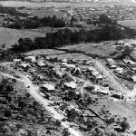 Cover image for Photograph - Aerial view of Sandy Bay showing Beddome Street, Waimea Avenue, Queenborough Oval & Rifle Range