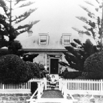 Cover image for Photograph - 'Poplarville' 68 Risdon Road, New Town - exterior views of front of house, garden and entrance gate and Pearce family - copy of original photograph only
