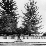 Cover image for Poplarville' 68 Risdon Road, New Town - exterior views of house  showing garden, front fence and entrance from Risdon Road and shade-house and other out-buildings and Pearce family at front gate on wedding day, 1905 - copy of original photograph only