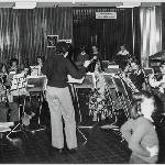 Cover image for Miscellaneous photographs - No.s 65-67 Concert in State Library foyer with onlookers.