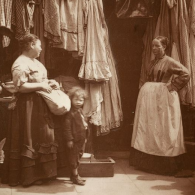 Photo of two women and a child outside a shop 1800s