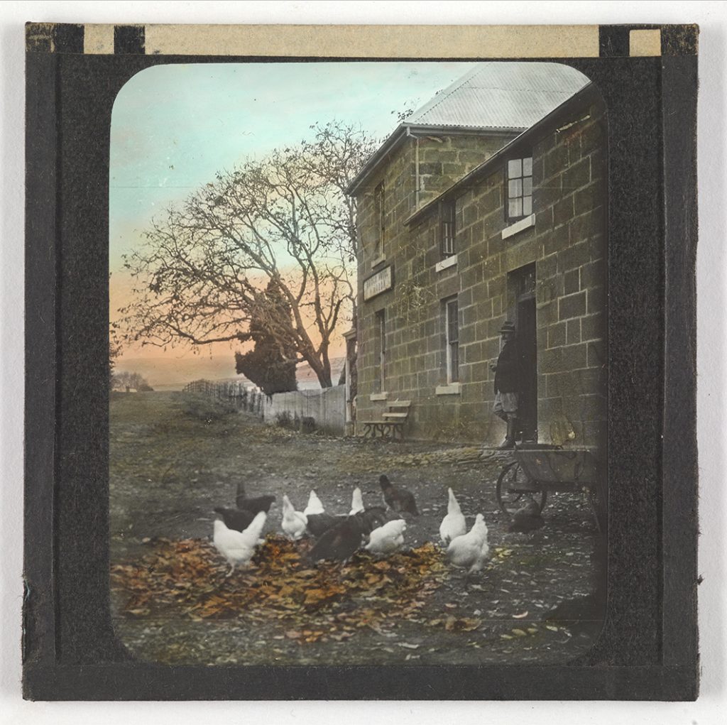 Photograph - Bridge Hotel at Ouse, with man and chickens in yard (hand coloured) [Lantern Slide] [Box 4]