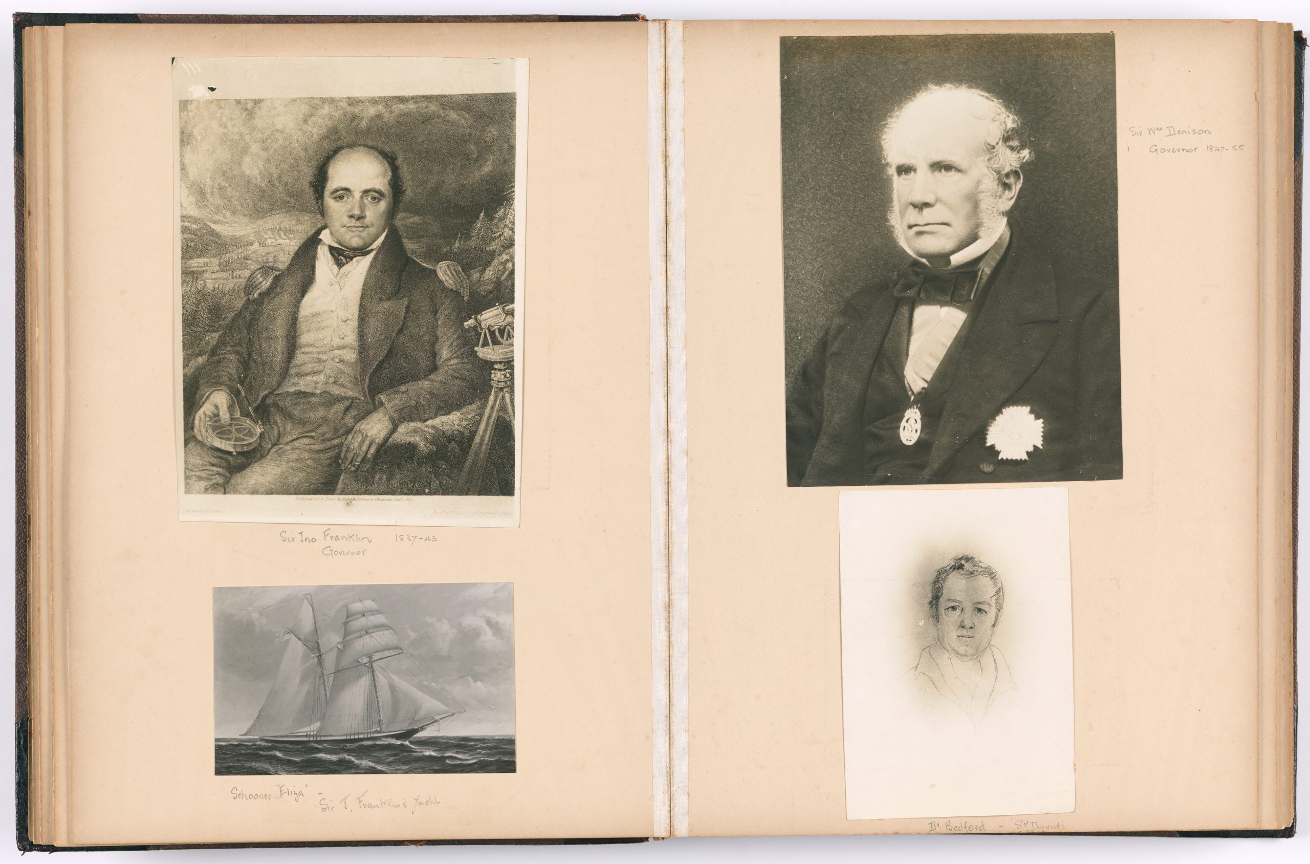 A scan of an old photo album with 4 old images: A drawing of a Sir john franklin sitting in a chair. A drawing of a sailing yacht (Eliza) on the ocean. A photo of a Sir William Denison in a suit and a drawing of a man.