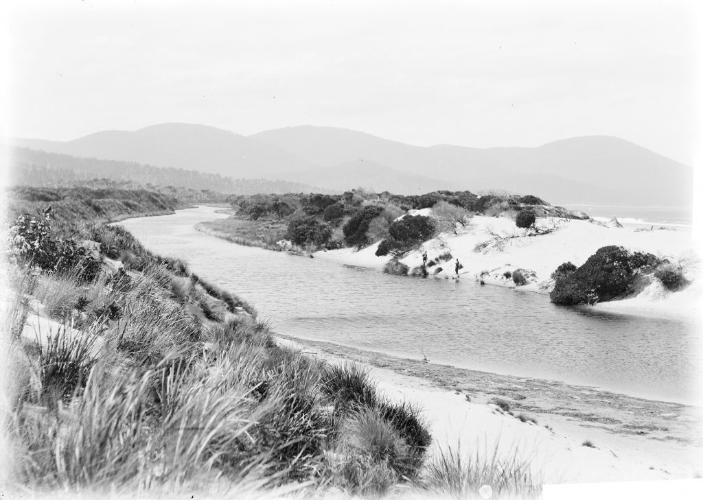 An old black and white photo of a river