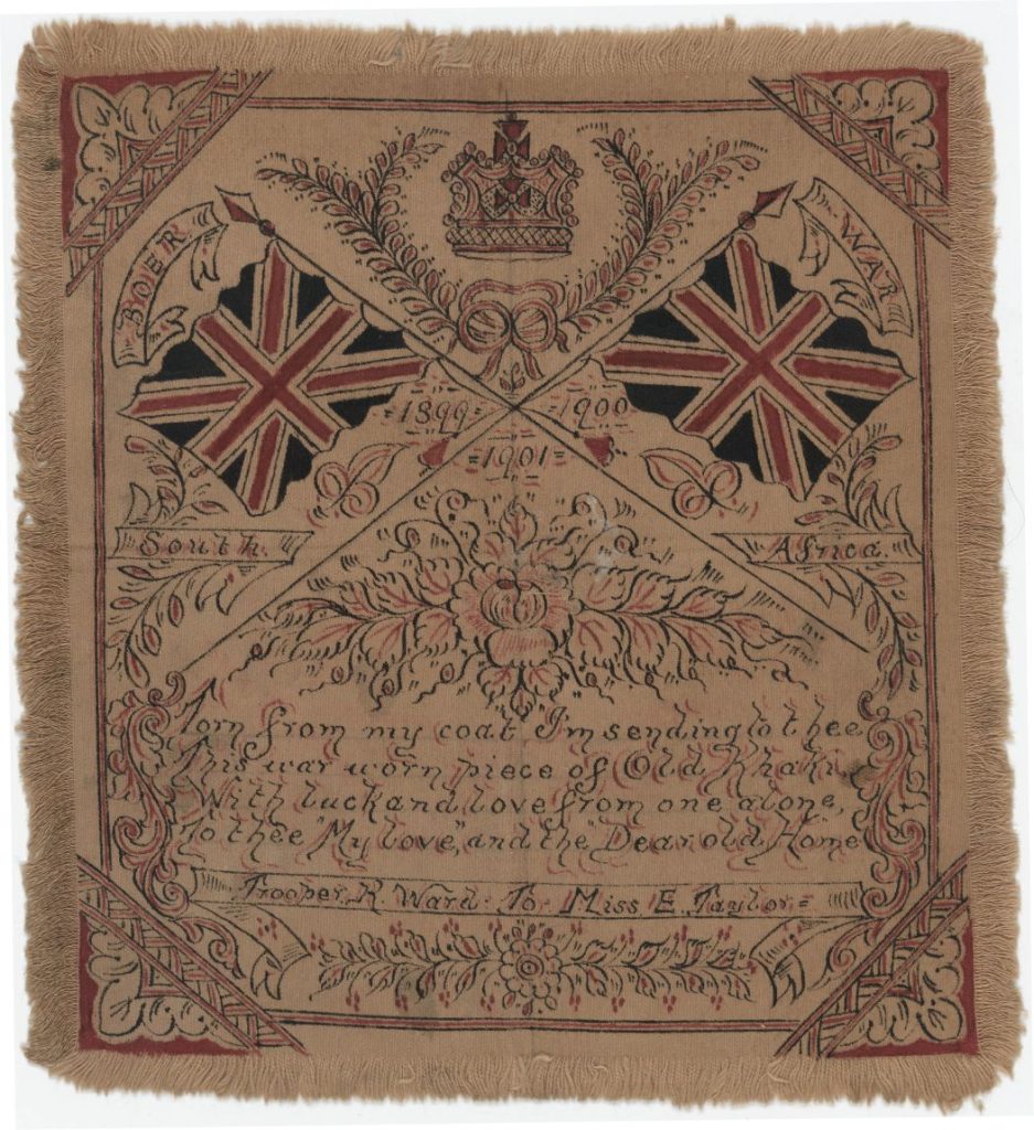 A wart tunic. it shows a crown and two British flags with an inscription.