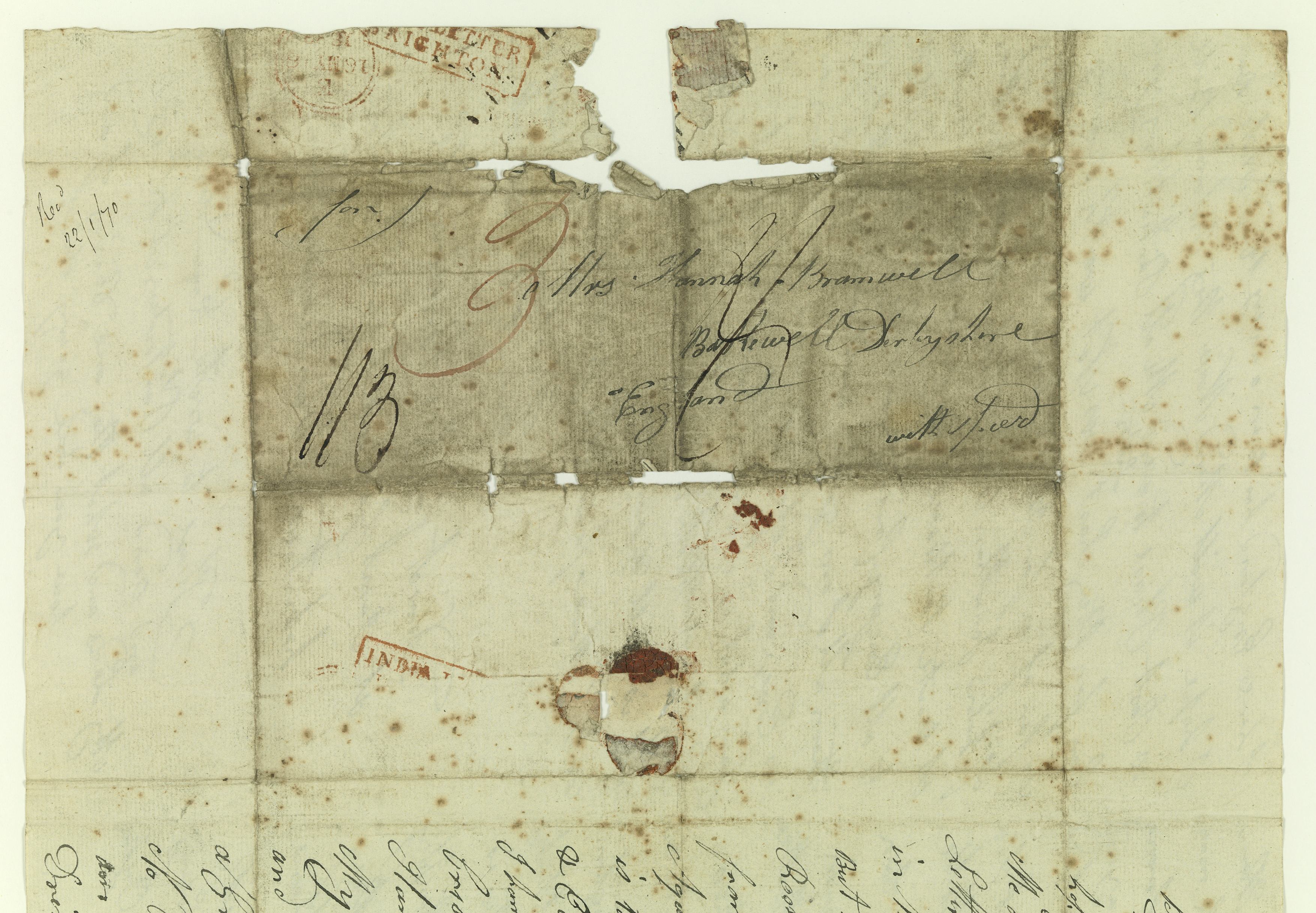 An old piece of paper with cursive text on it. Text illegible.