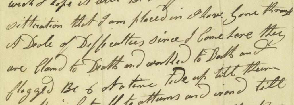 An old piece of paper with cursive text on it. text illegible.