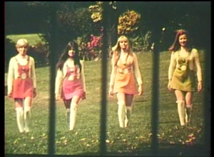 a still taken from the Film – The Other Face Of The Island. 4 women walking towards the camera