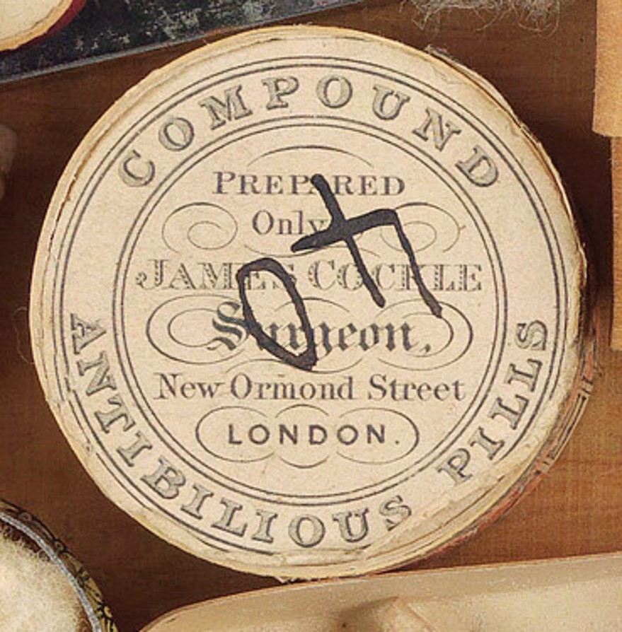 A round container - Imported antibilious pills for a distressed digestion - repurposed to house shells.