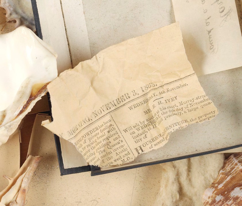 A scap peice of newspaper in a box. The date reads November 3, 1863