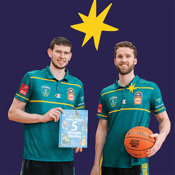 Two basketball players from the Tasmanian Jack Jumpers. One holds a book, the other holds a basketball.
